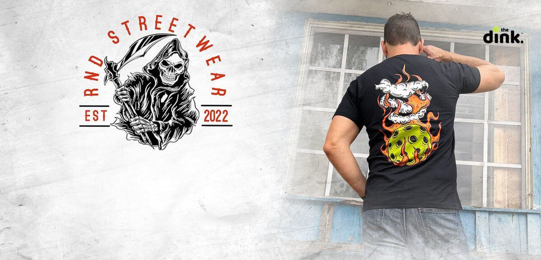 "RND Streetwear pickleball t-shirt featuring a vibrant design, with brand logo next to a man standing in front of a window"