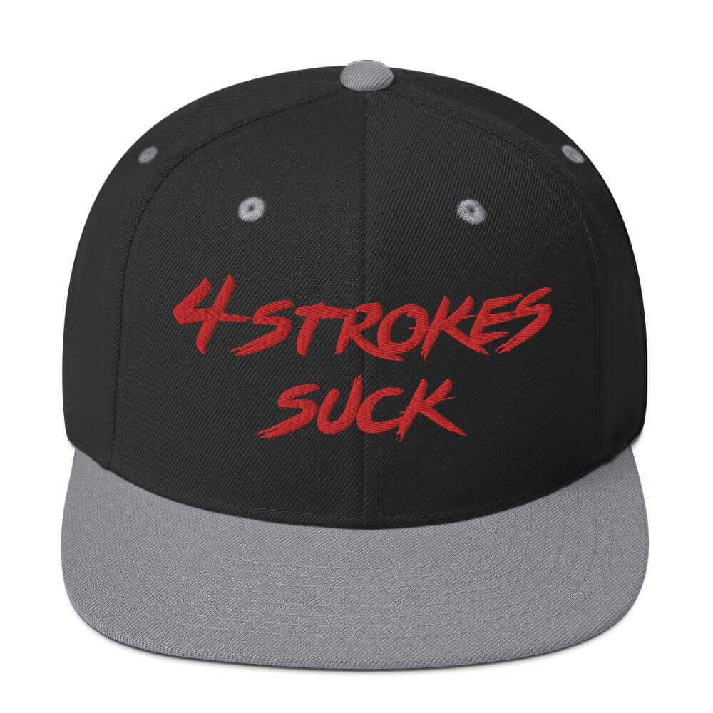 Black and gray snapback hat with red "4 Strokes Suck" embroidery, celebrating motocross and Ronnie Mac's rebellious spirit.