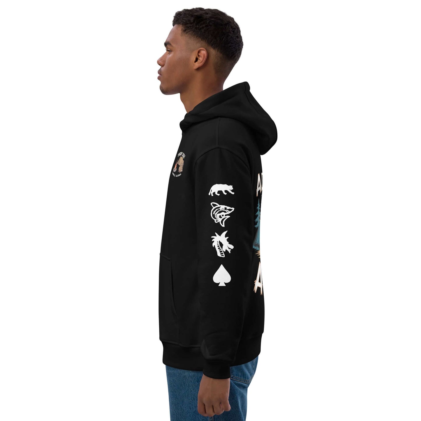 Side view of a man wearing an Adult Premium Eco Hoodie – Camping Edition with unique graphics.