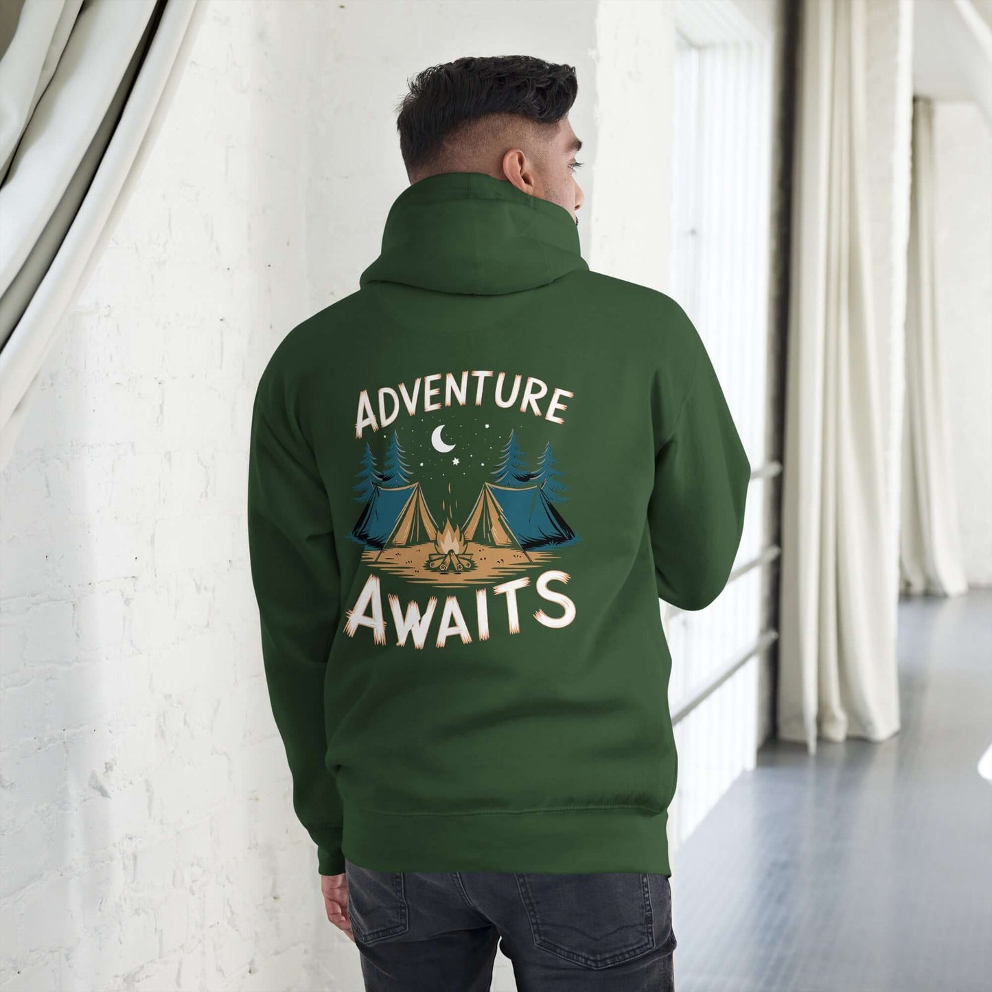 Back view of a man wearing green Adult Unisex Hoodie with 'Adventure Awaits' and camping design, perfect for outdoor enthusiasts.