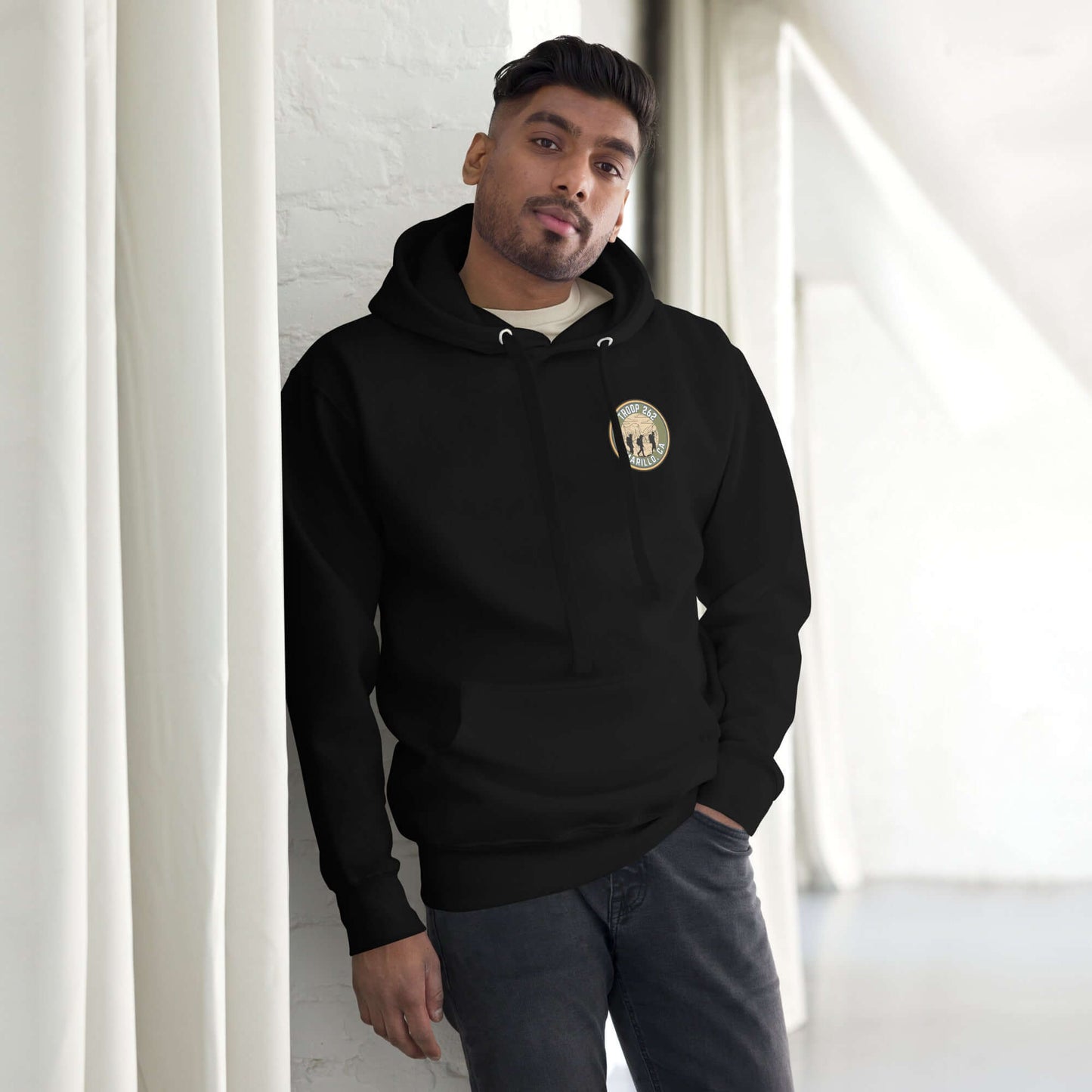 Adult unisex hoodie in black, showcasing a front pouch pocket and classic design, perfect for outdoor adventures.