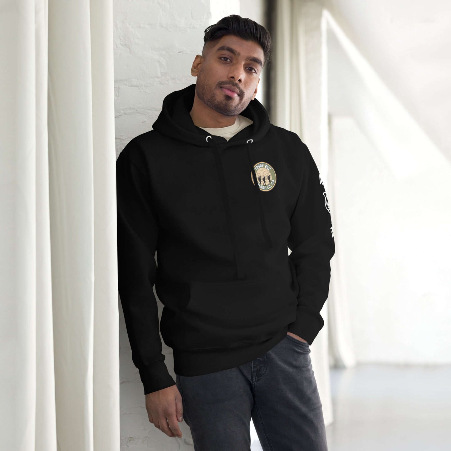 Adult unisex hoodie in black featuring a front logo and a stylish streetwear design.