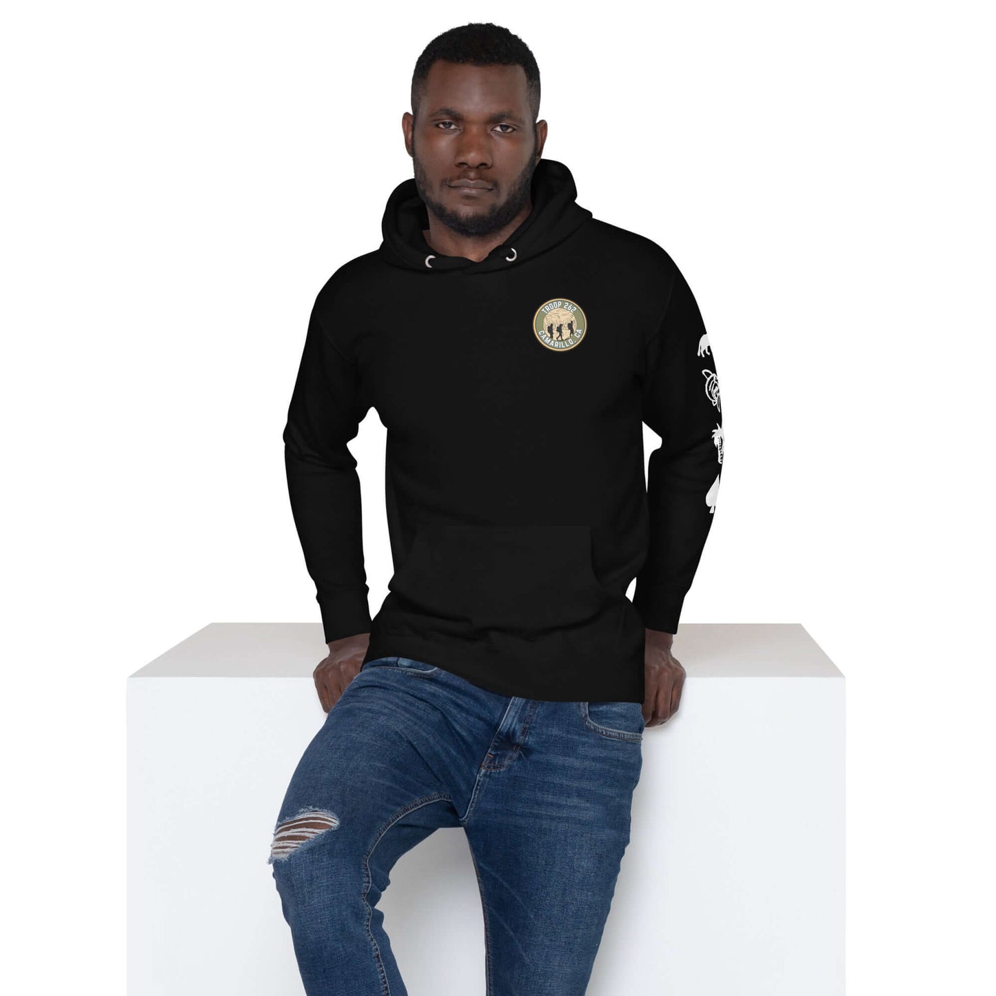 Adult unisex black hoodie with logo, modeled by a man, showcasing streetwear style and comfort.