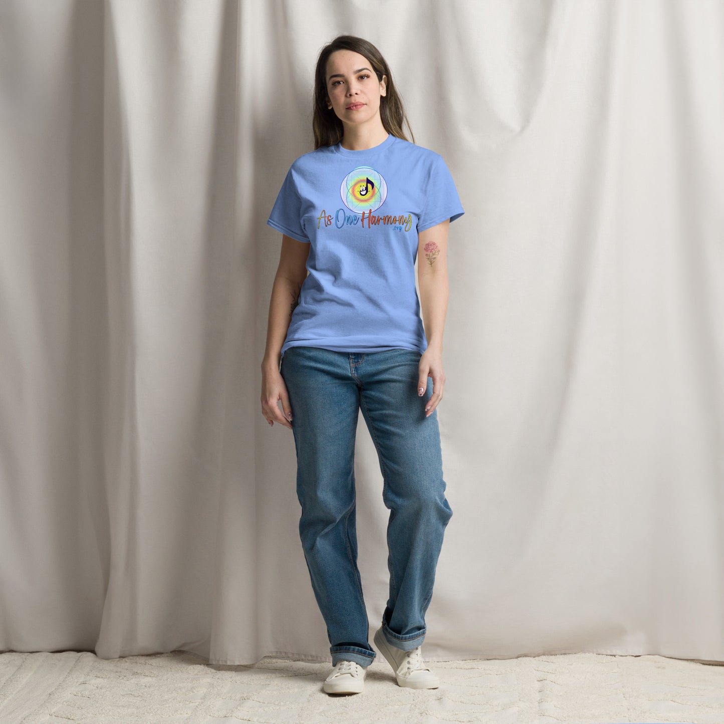 Unisex classic cotton tee in light blue with 'As One Harmony' design, styled with jeans and sneakers.
