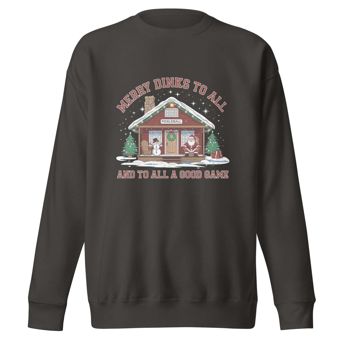 Cozy Pickleball Cabin Merry Dinks Holiday Sweatshirt with festive cabin, snowman, Santa, and Christmas trees under starry sky.