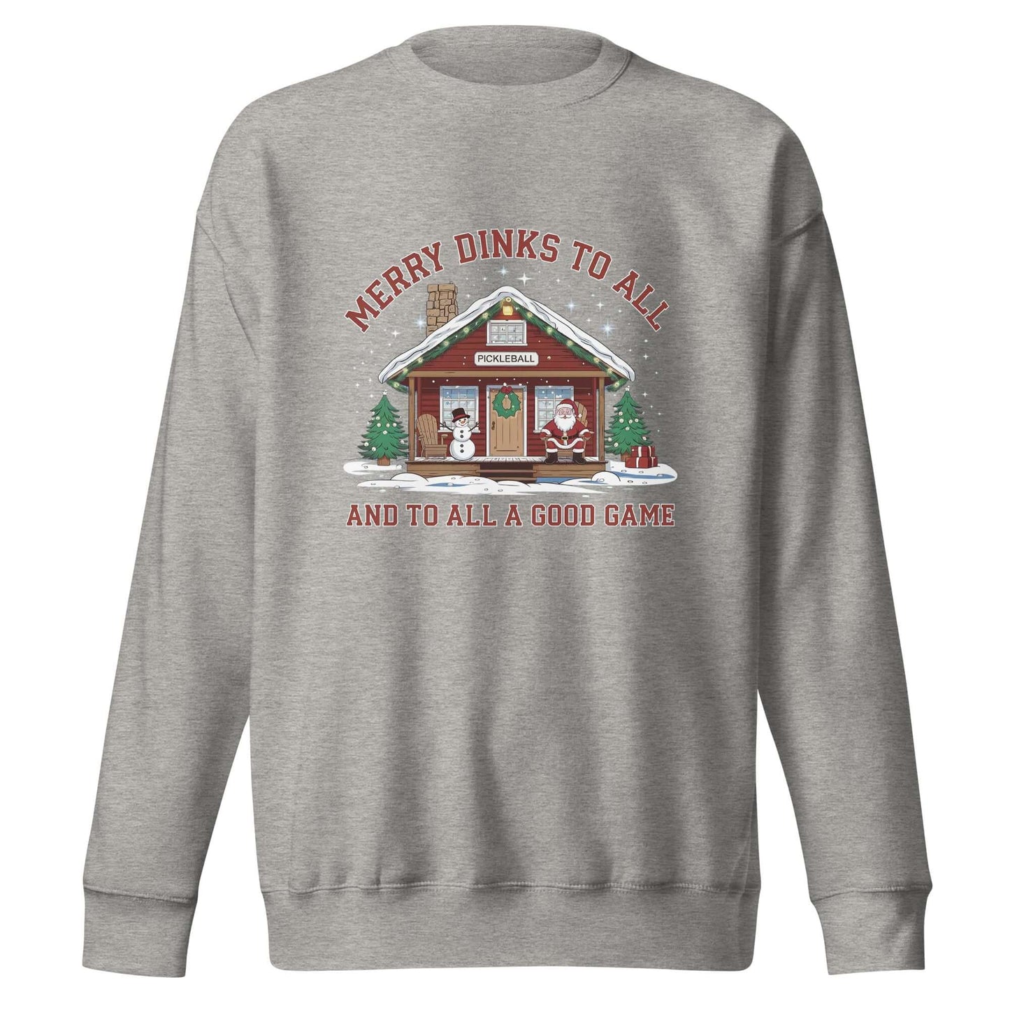 Cozy Merry Dinks holiday sweatshirt featuring a pickleball cabin, festive snowman, Santa, and Christmas trees under a starry sky.
