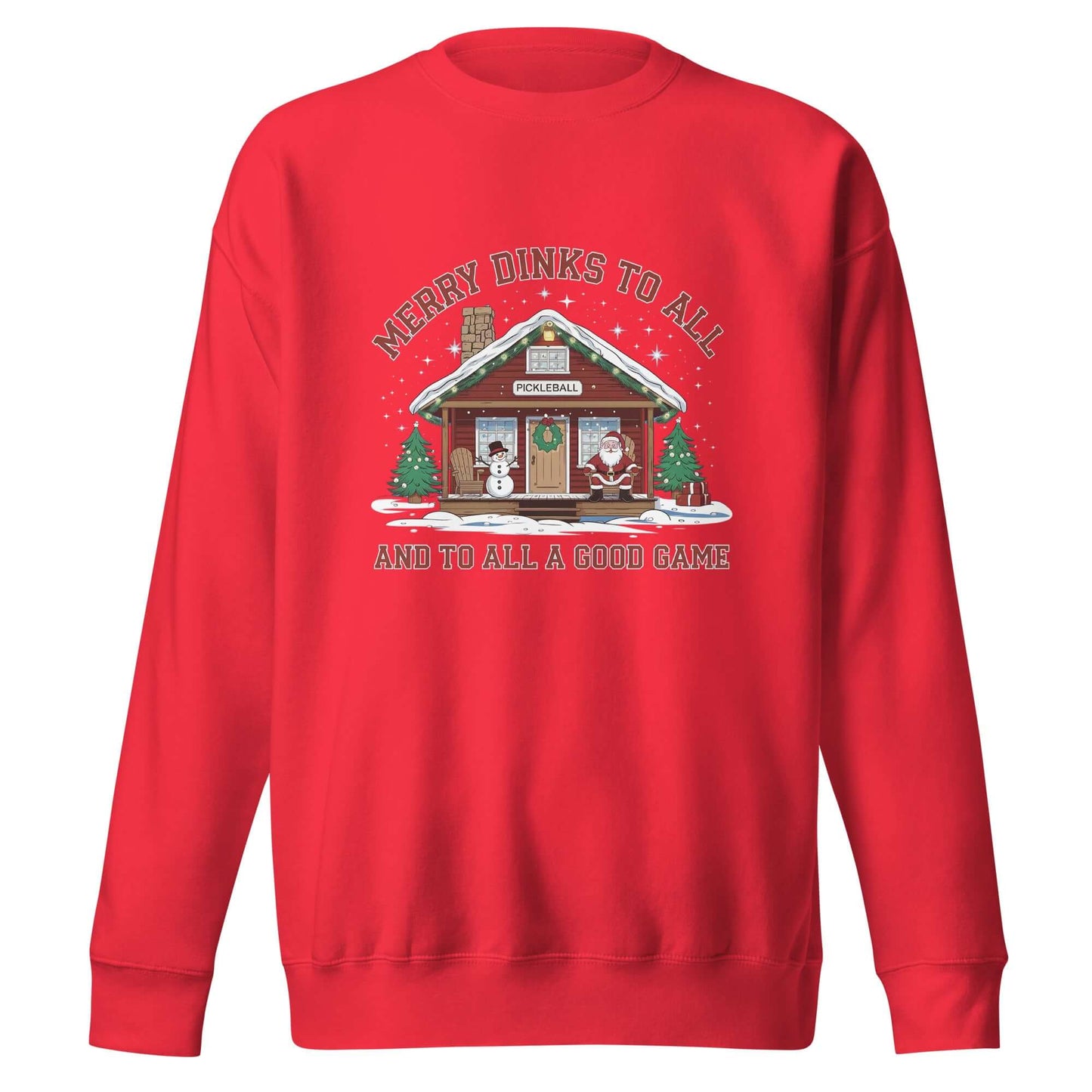 Red holiday sweatshirt with pickleball cabin illustration, snowman, Santa Claus, Christmas trees, and "Merry Dinks to All" message.