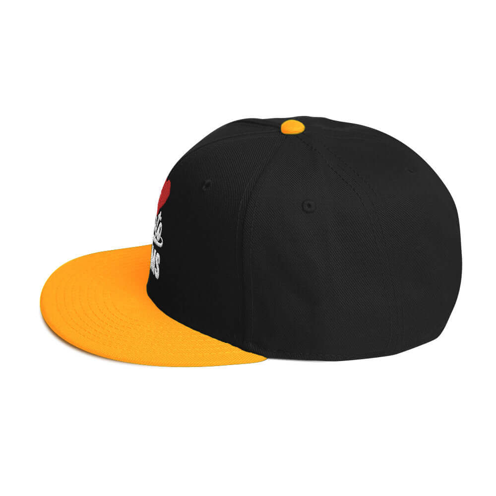 left side of Ronnie Mac 69's I Heart Moto Mom's Embroidered Snapback Hat (gold/Black)