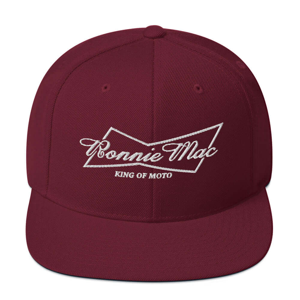 King of Moto embroidered snapback hat in burgundy with Ronnie Mac logo, classic flat brim design, perfect for motocross enthusiasts.