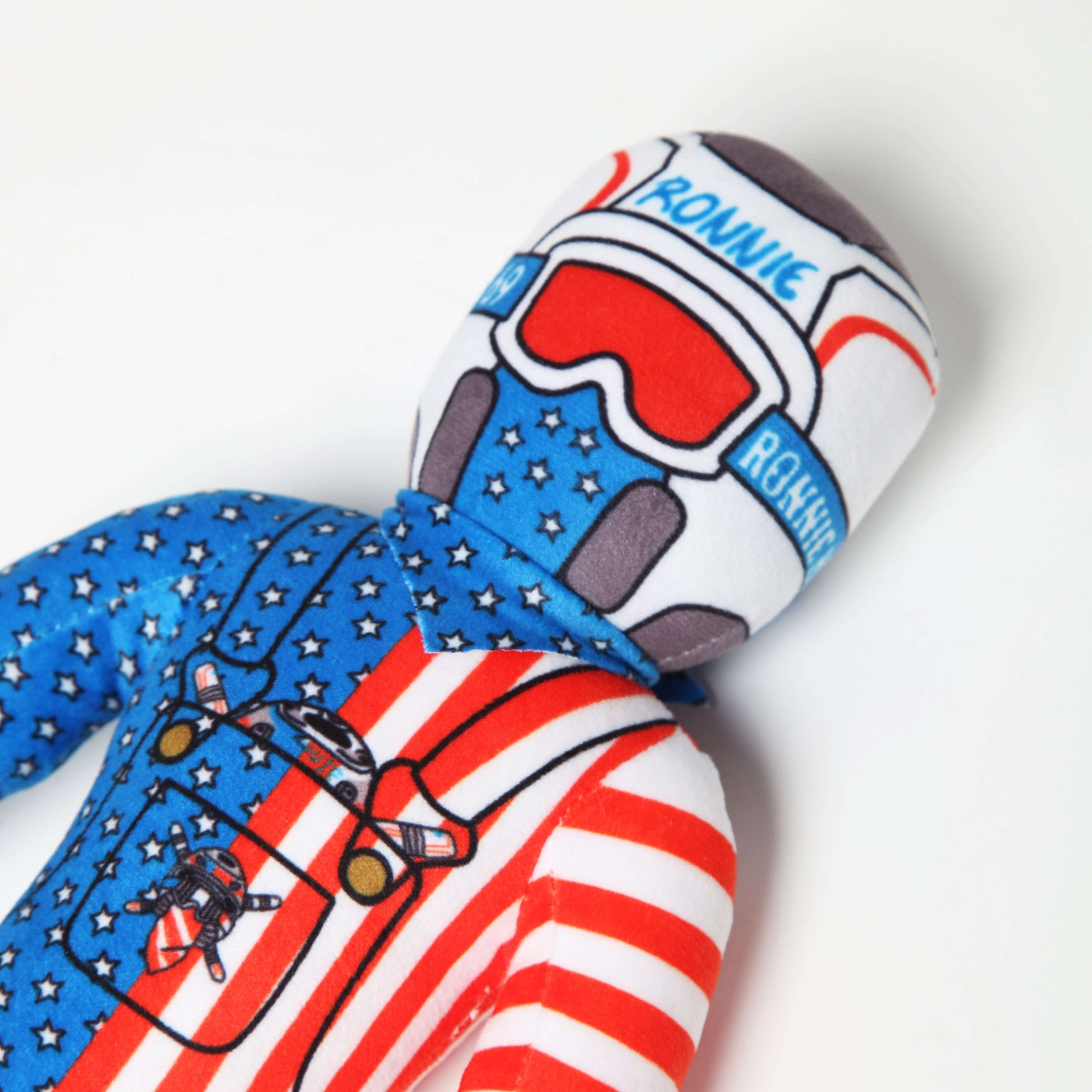 Lil Ronnie Merica Plush in patriotic outfit with stars and stripes, evoking a playful and mischievous vibe.