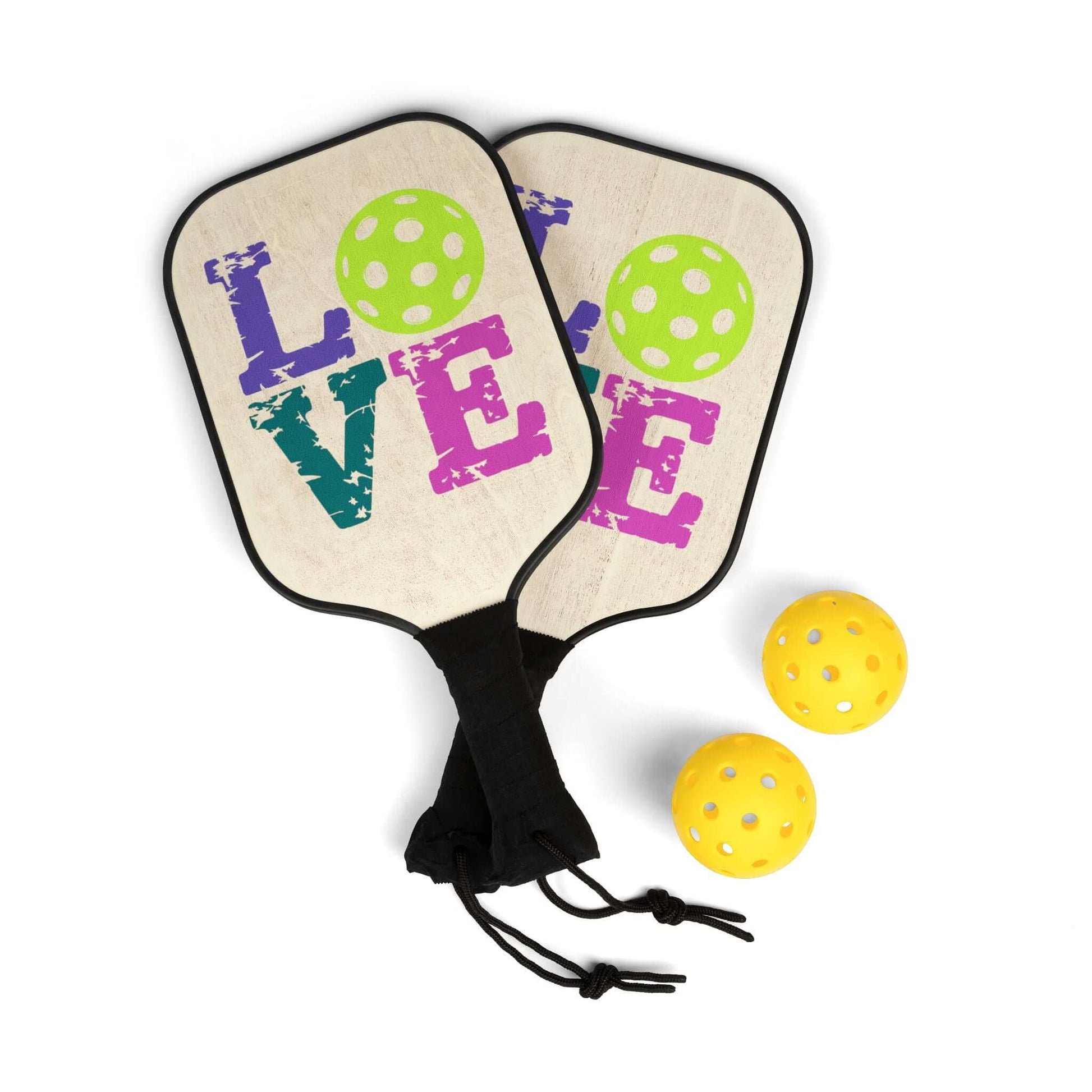 LOVE Pickleball paddles with bright green balls, showcasing style and passion for pickleball in every game.