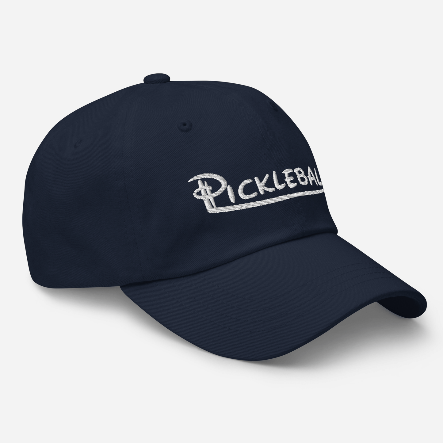Low profile navy pickleball hat with embroidered logo, adjustable strap, and curved visor.
