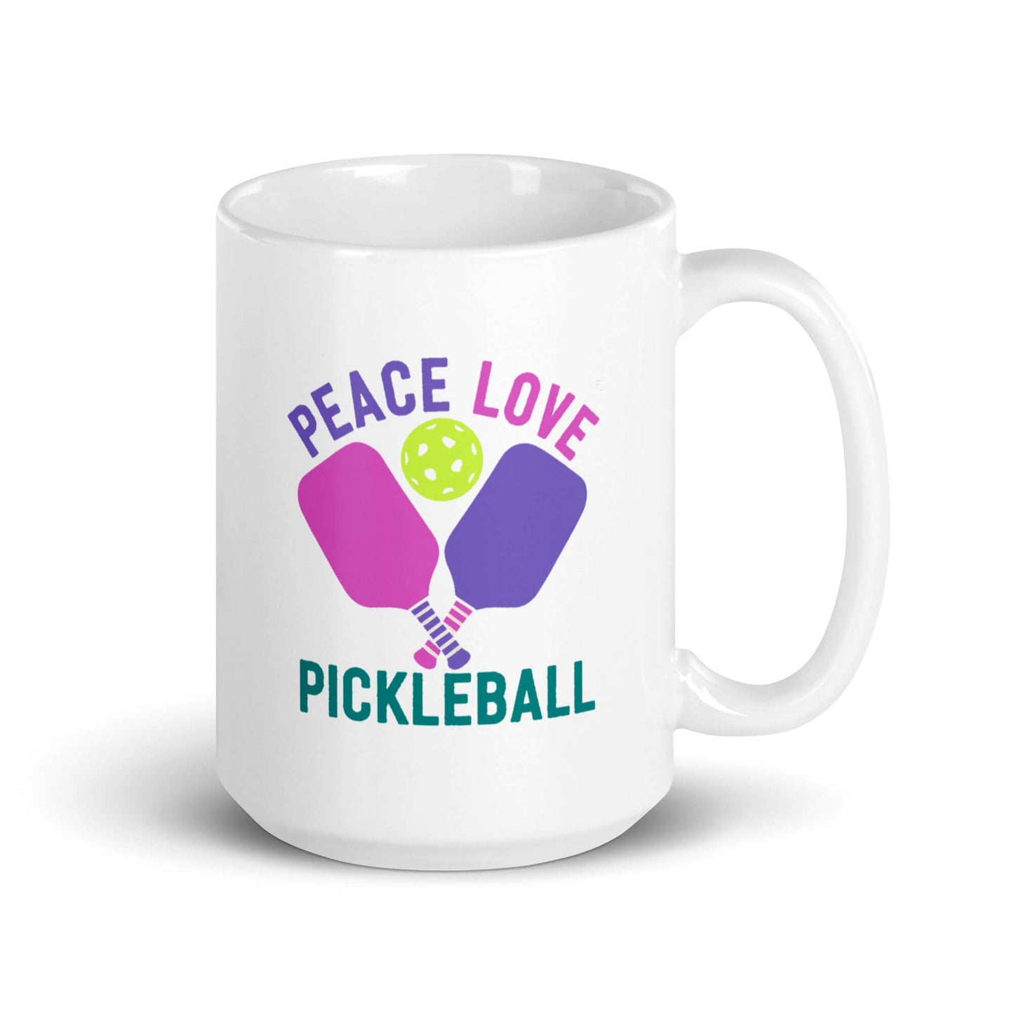 White glossy mug with 'Peace Love Pickleball' graphic and paddles design, perfect for pickleball fans.