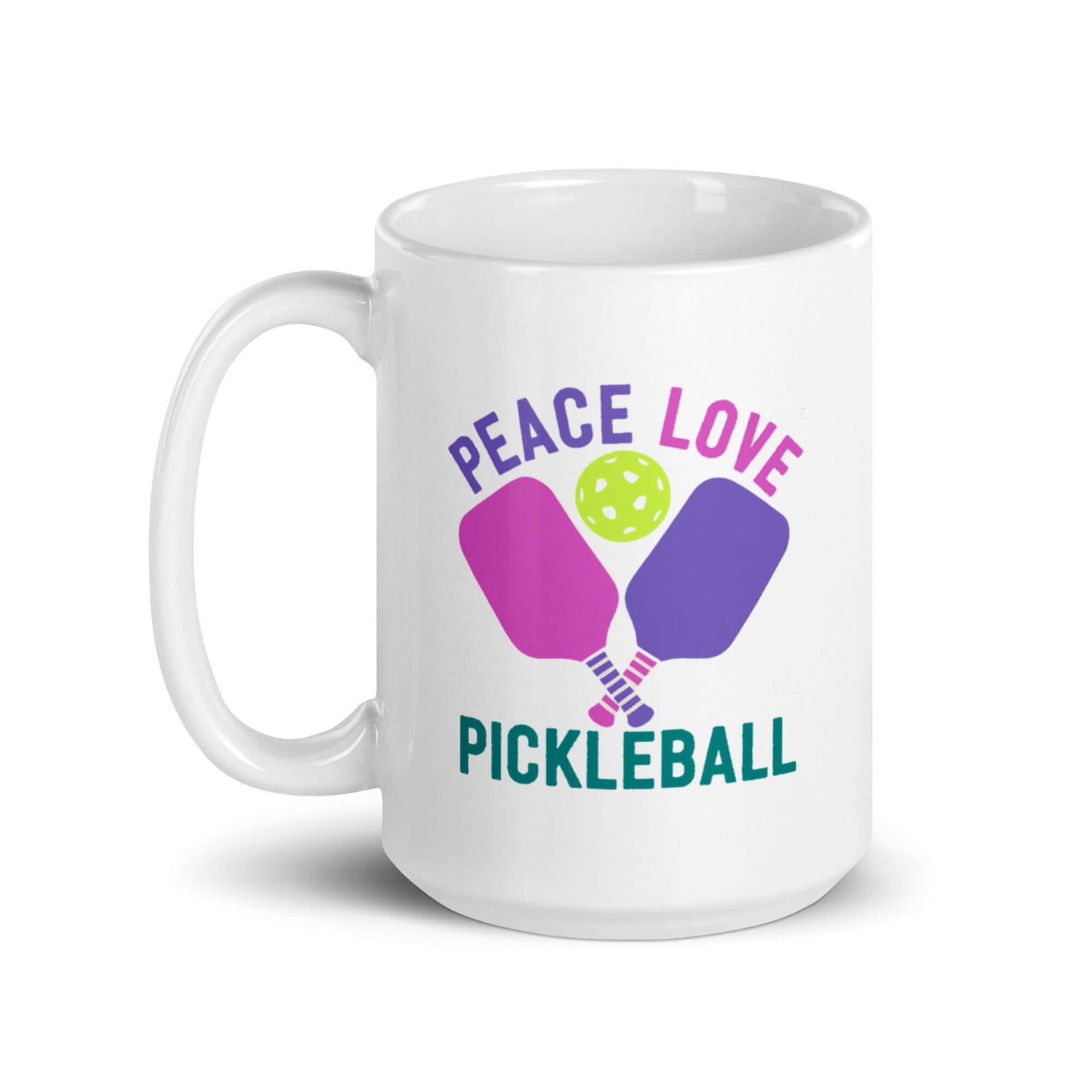 White glossy mug with colorful 'Peace Love Pickleball' design, featuring paddles and a ball.