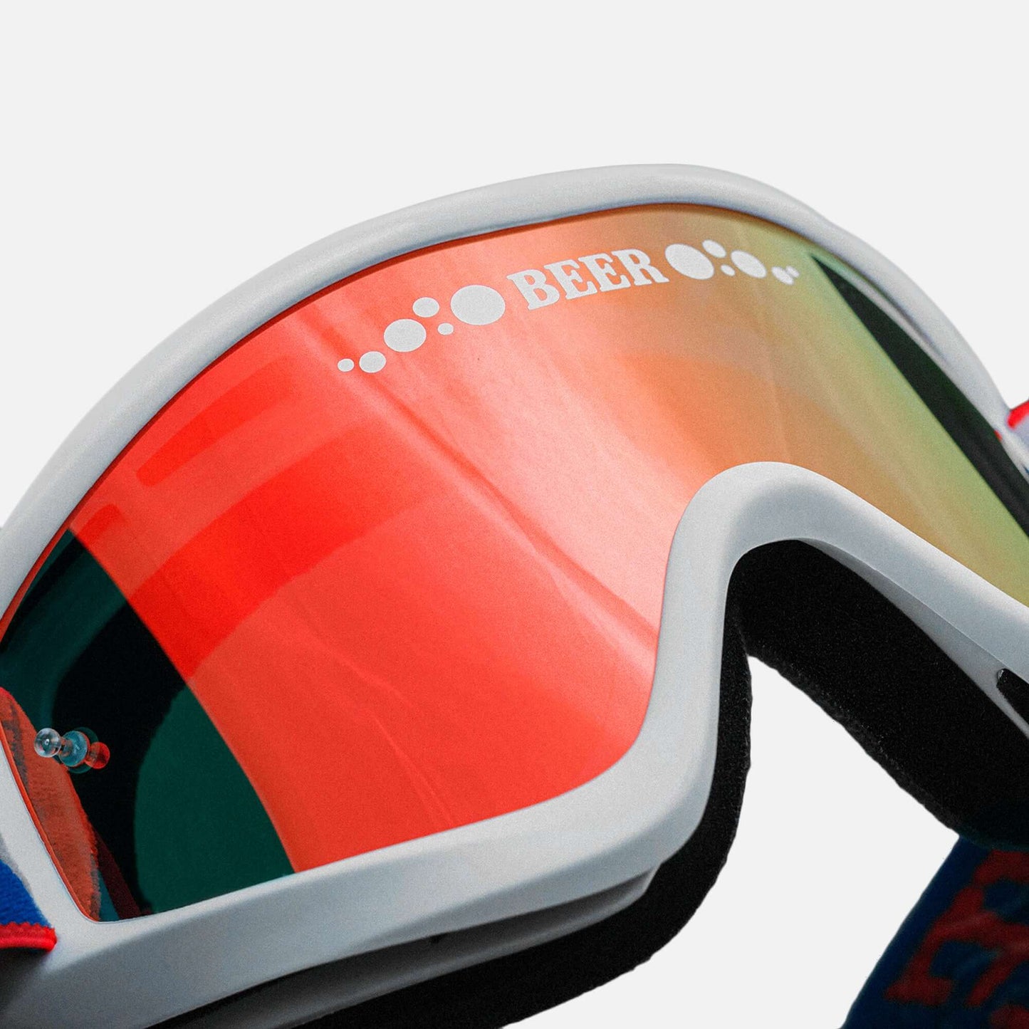 Stars and Bars Beer Optics goggles with red reflective lens, designed for comfort and protection against dust and debris.