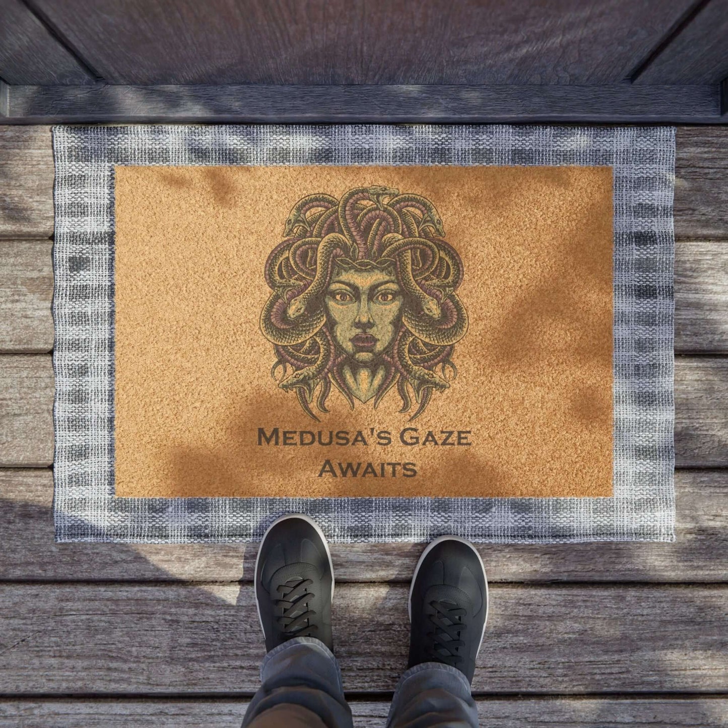 Medusa Halloween doormat with eerie design and text "Medusa's Gaze Awaits" at doorstep, perfect for spooky decor.