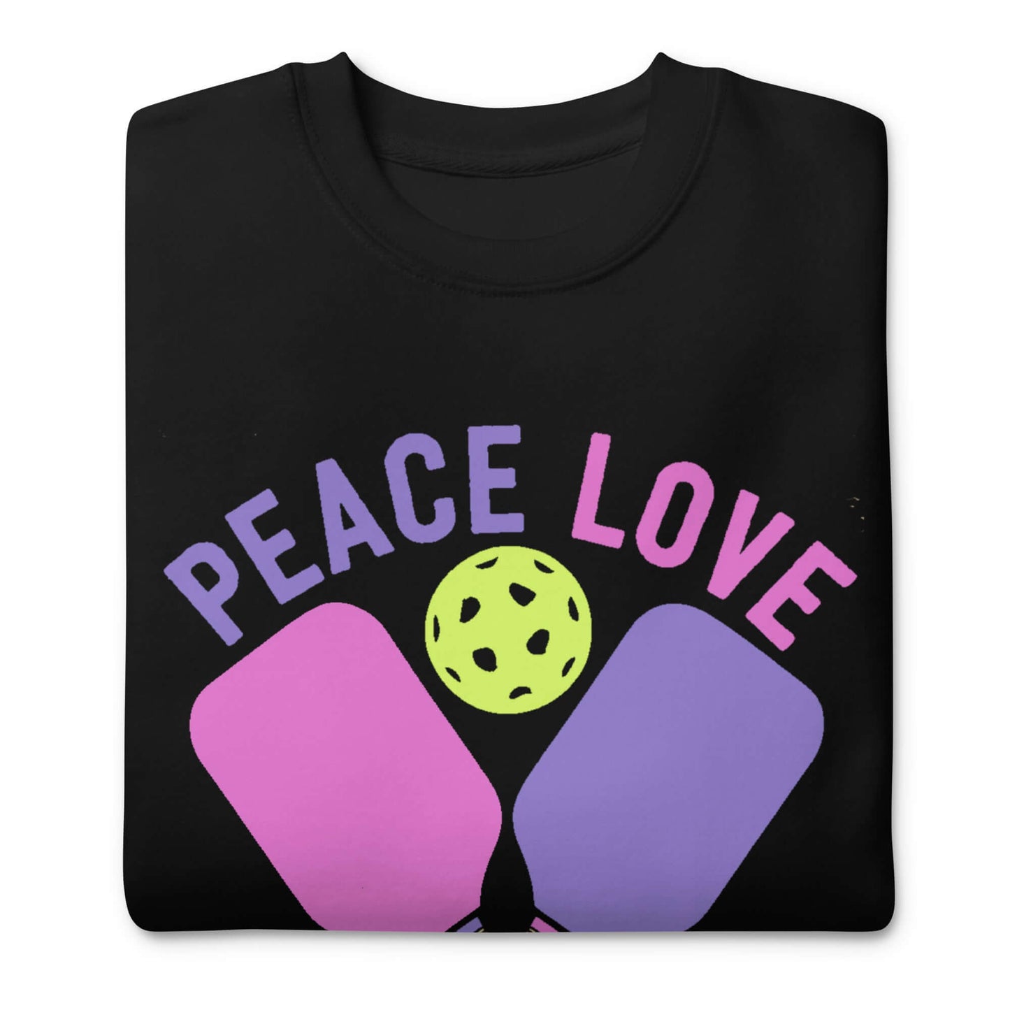 Women's Peace Love Pickleball sweatshirt with playful graphic on black fabric.