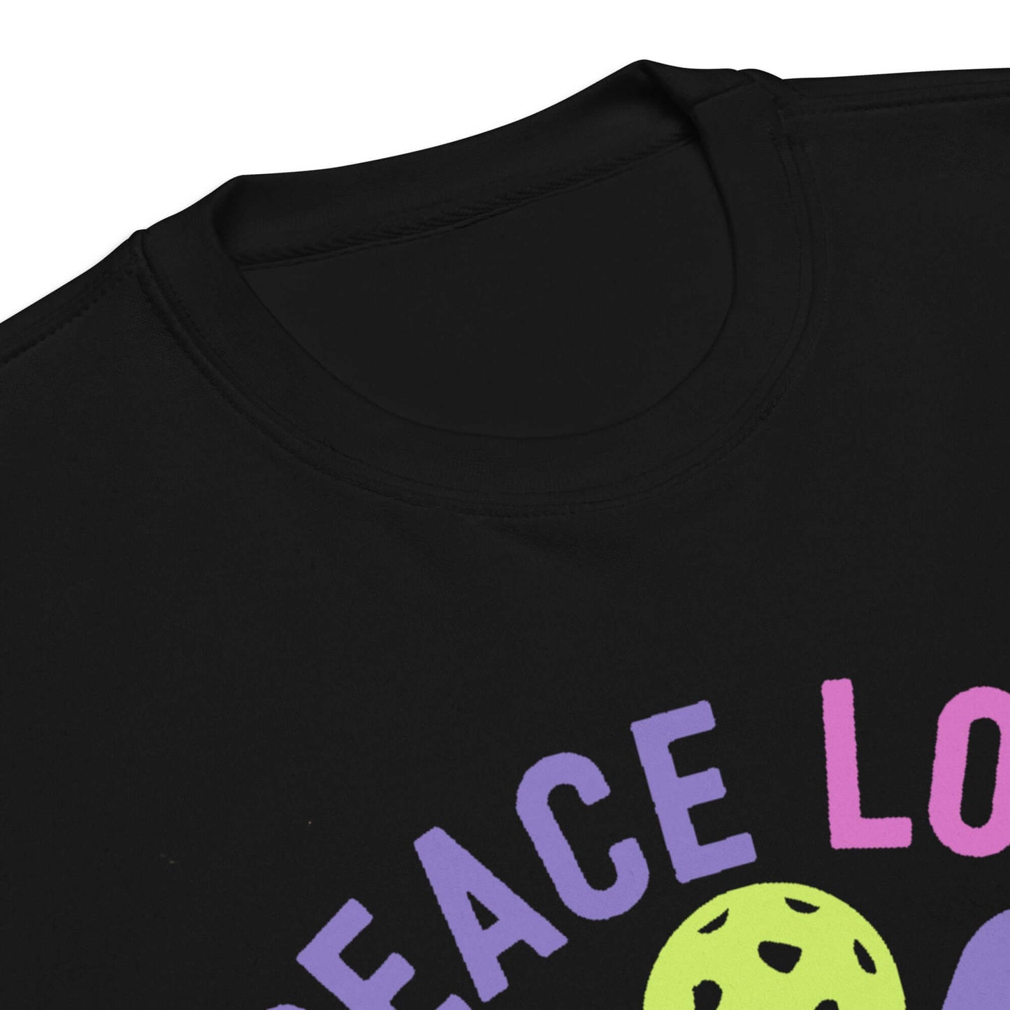 Close-up of Women's Peace, Love, Pickleball Premium Sweatshirt featuring colorful lettering and a round neckline.