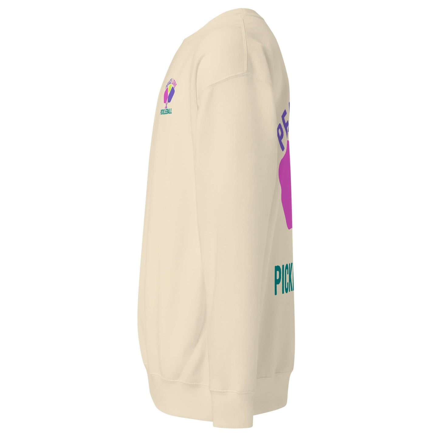 Women's Peace, Love, Pickleball Premium Sweatshirt side view in beige with vibrant graphics.