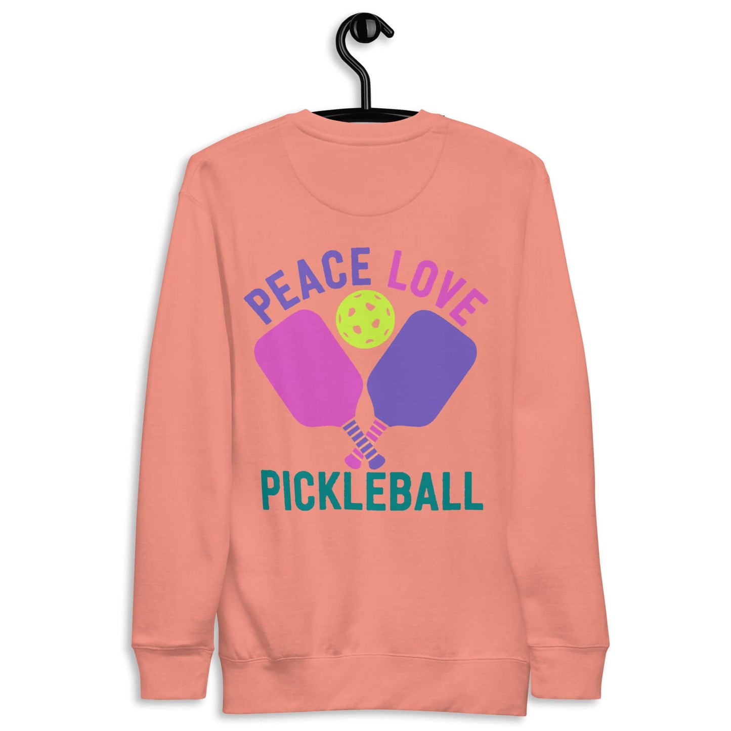 Women’s peach sweatshirt with 'Peace Love Pickleball' print, perfect for pickleball enthusiasts and casual wear.
