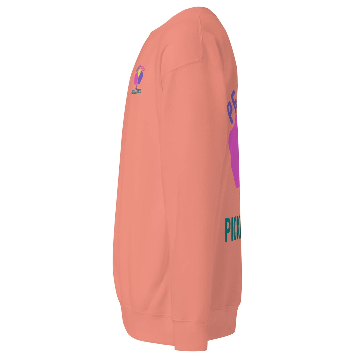 Side view of Women's Peace, Love, Pickleball Premium Sweatshirt in coral, showcasing stylish design and comfy fit.