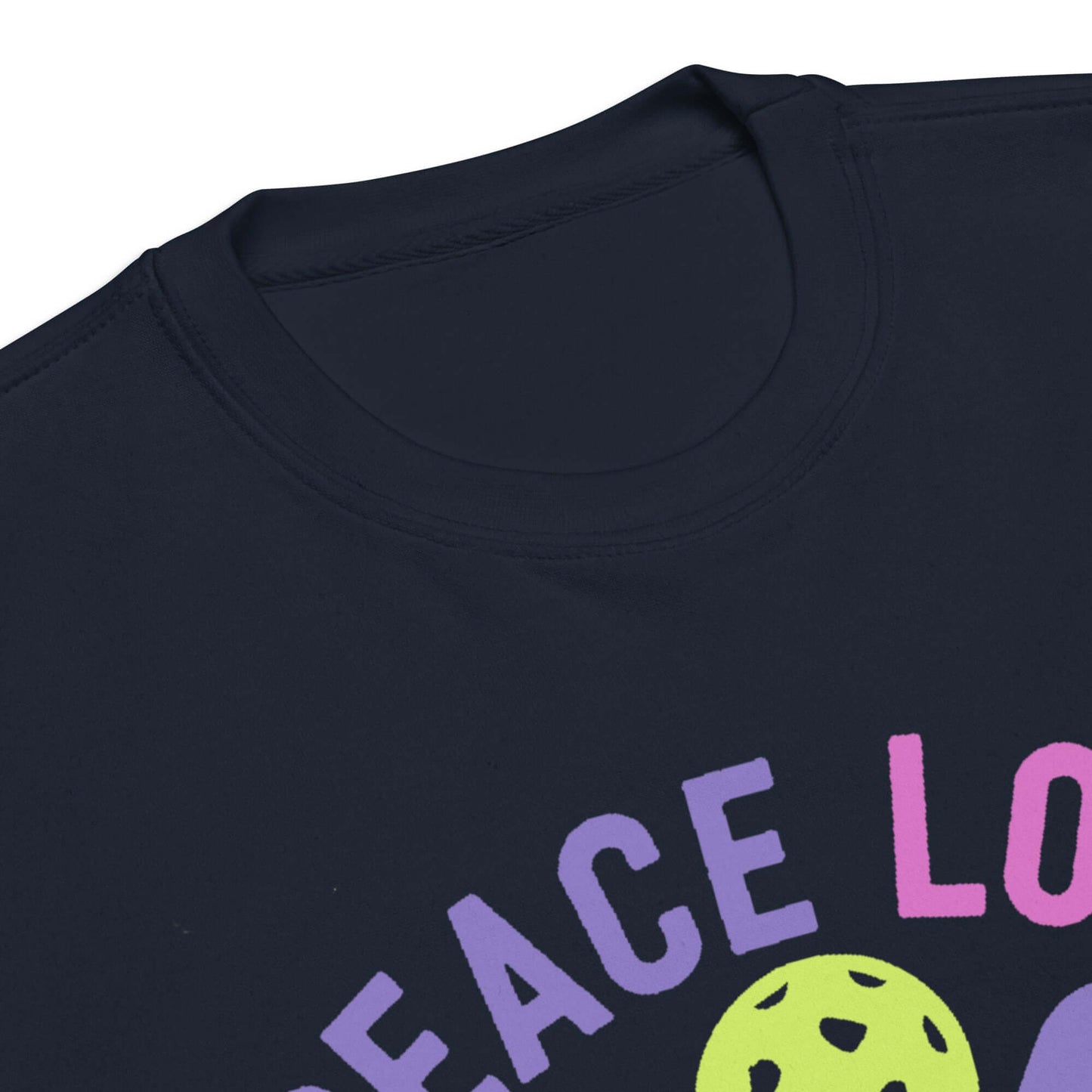 Close-up of Women's Peace, Love, Pickleball sweatshirt collar with colorful graphic design.