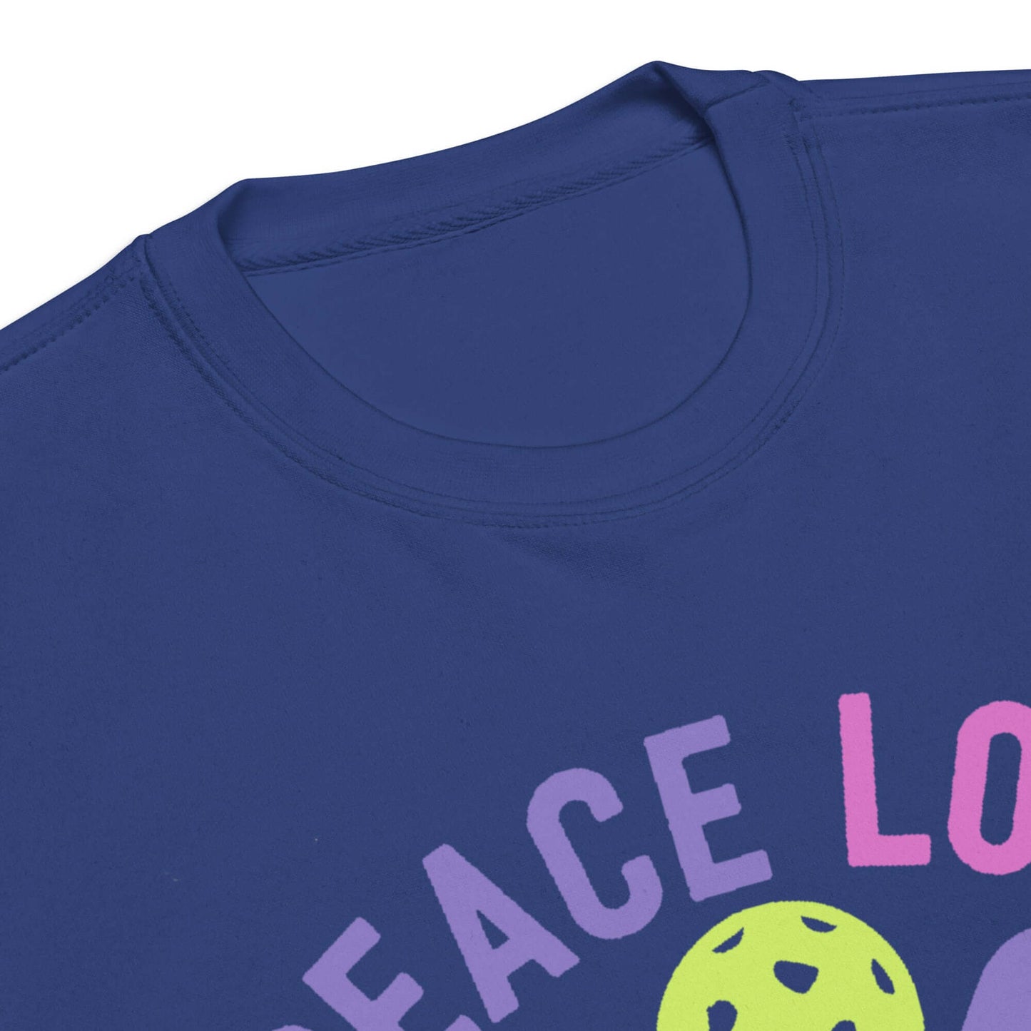 Close-up of Women's Peace, Love, Pickleball Premium Sweatshirt neckline featuring colorful design.