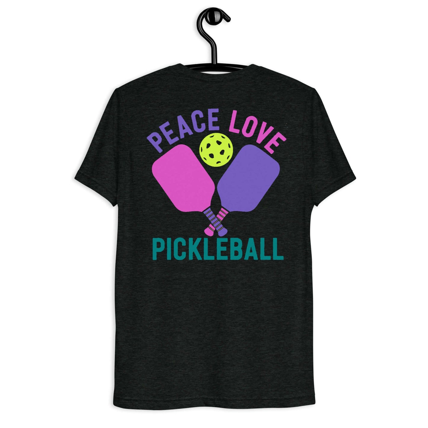 Women's Peace, Love, Pickleball Short Sleeve T-Shirt hanging on a hook, featuring colorful paddles and a pickleball design.