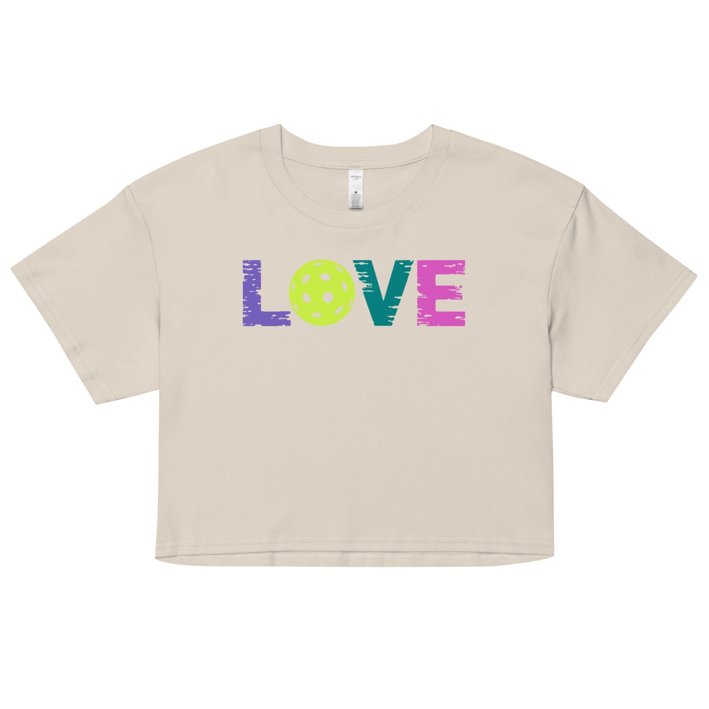 Women’s LOVE Pickleball Crop Top in beige with colorful text and pickleball design.