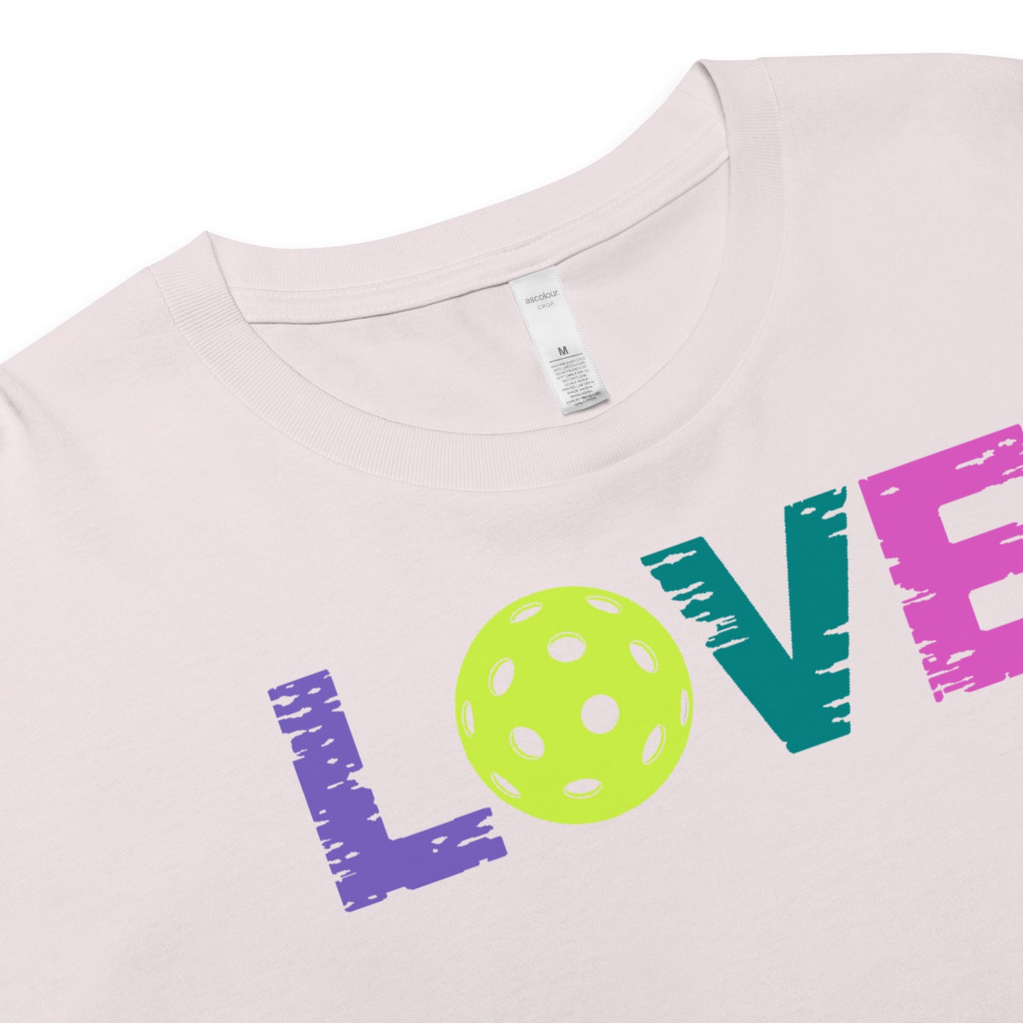 Close-up of Women’s LOVE Pickleball Crop Top featuring vibrant lettering and a pickleball graphic.