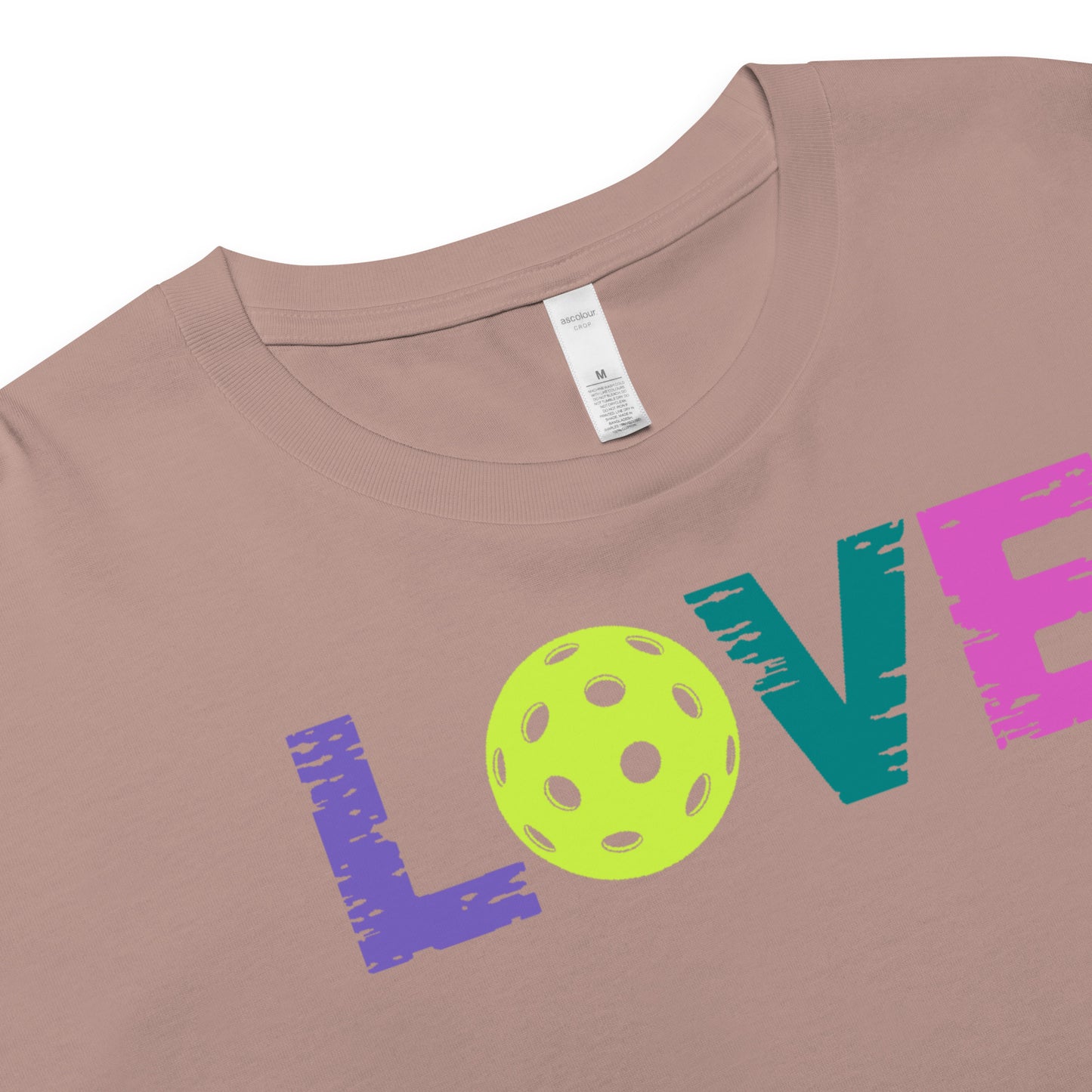 Women’s LOVE Pickleball Crop Top featuring bright letters and a pickleball design on a soft fabric.