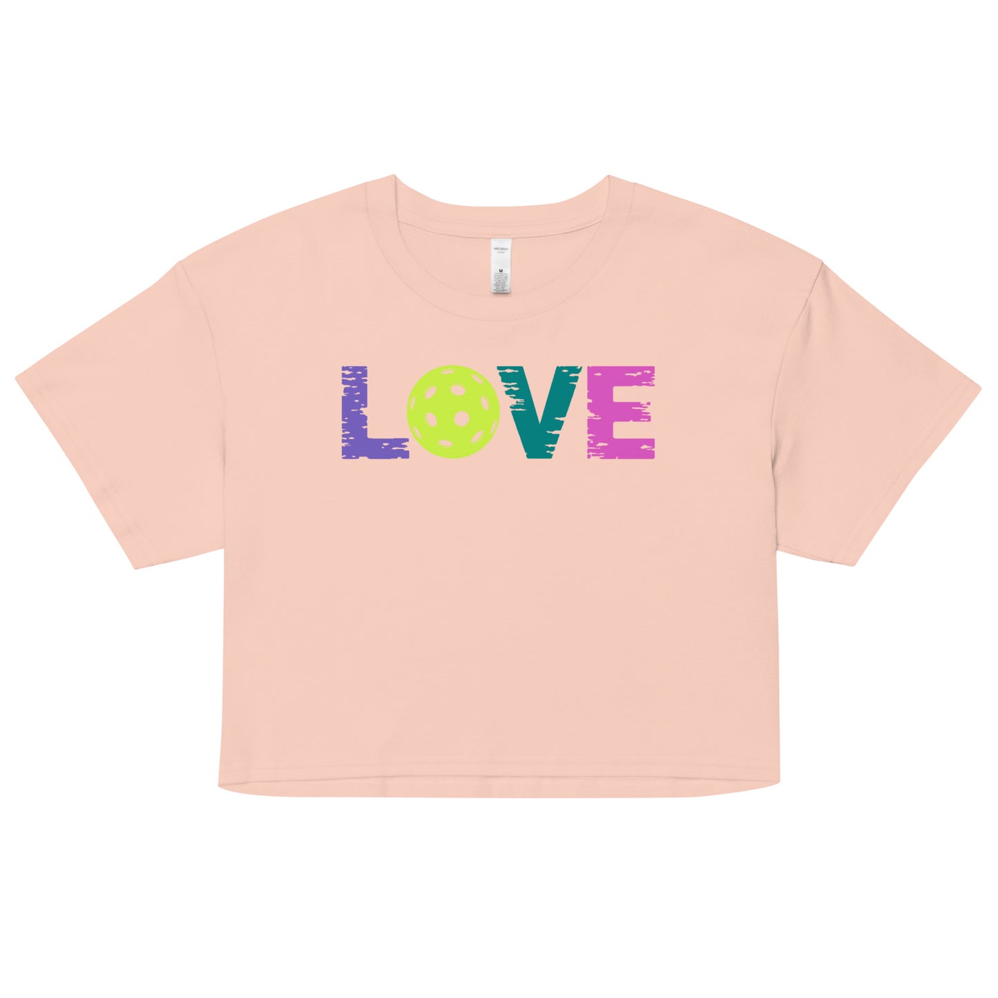 Women’s LOVE Pickleball Crop Top in peach with colorful 'LOVE' text and ball graphic, perfect for stylish pickleball enthusiasts.
