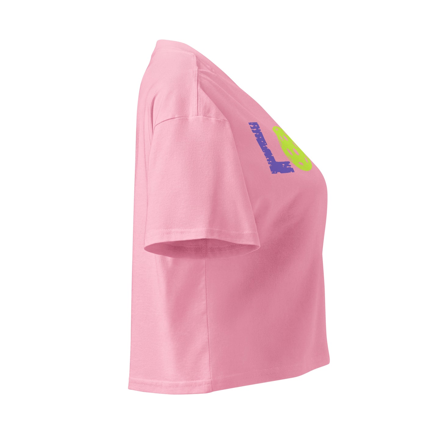 Side view of the Women’s LOVE Pickleball Crop Top in pink, featuring a vibrant graphic design and a relaxed fit.