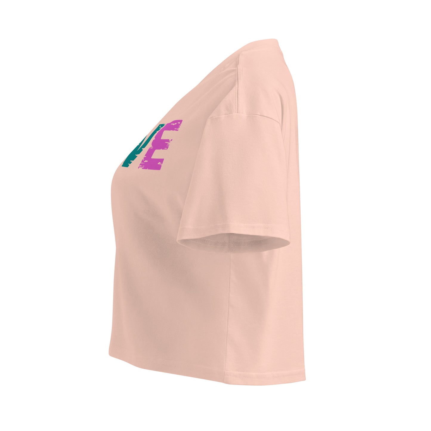 Side view of Women's LOVE Pickleball Crop Top in soft beige with colorful graphic design.