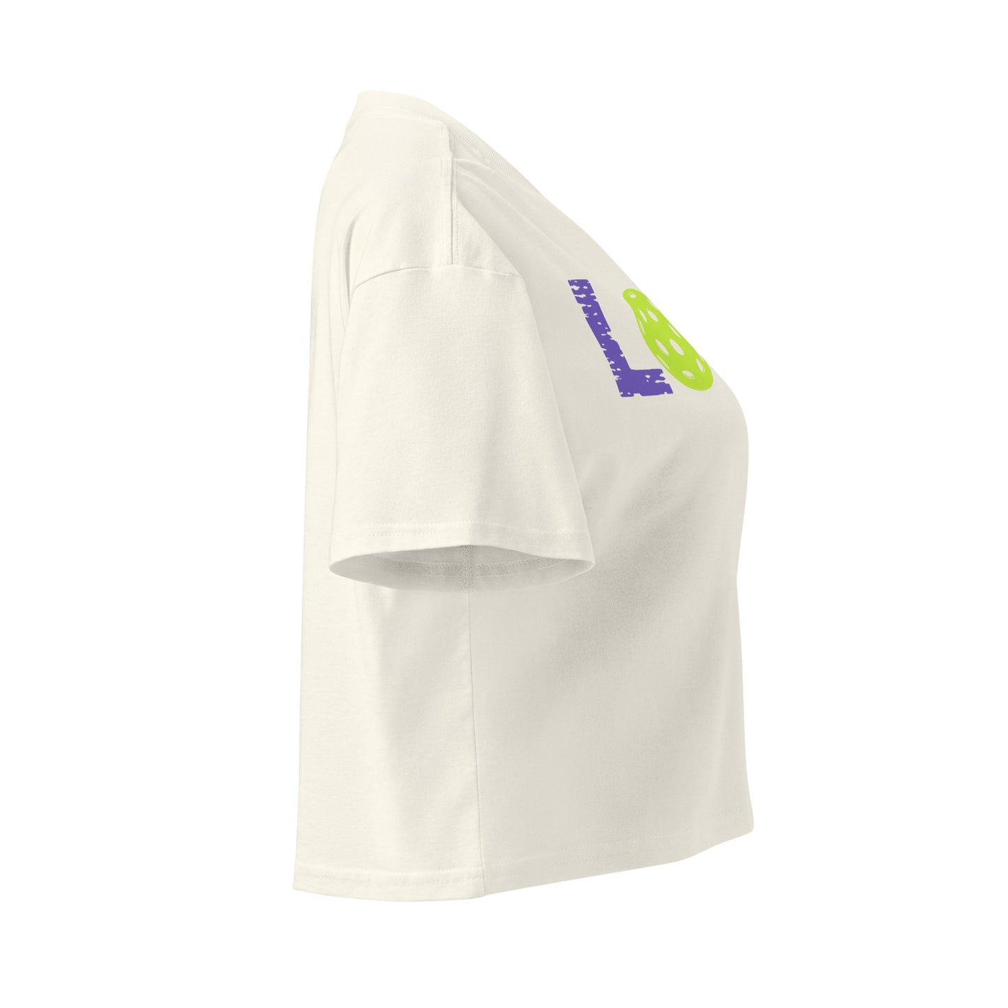 Side view of Women’s LOVE Pickleball Crop Top in white, showcasing vibrant pickleball graphics.