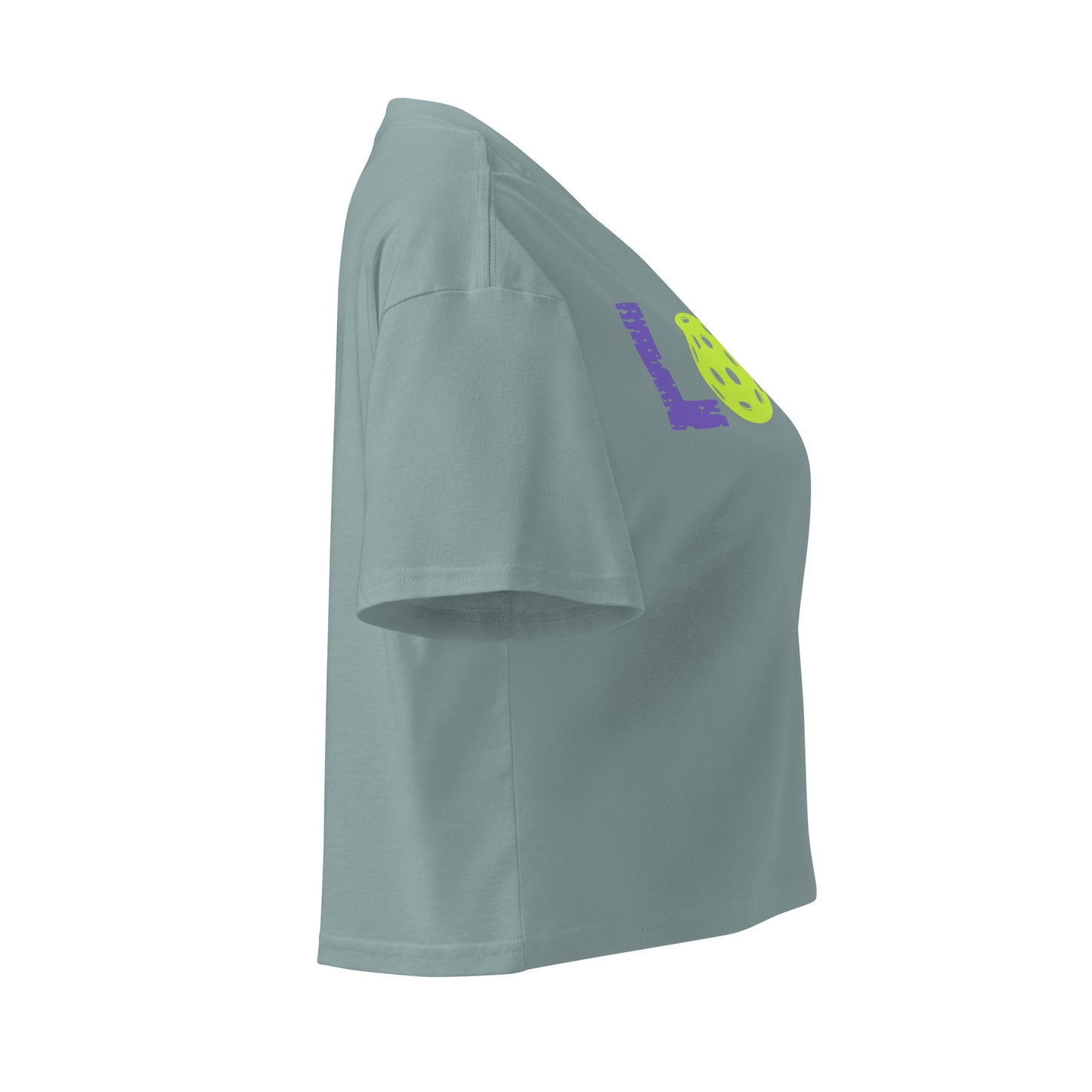 Side view of Women's LOVE Pickleball Crop Top in green, showcasing its stylish design and soft cotton fabric.