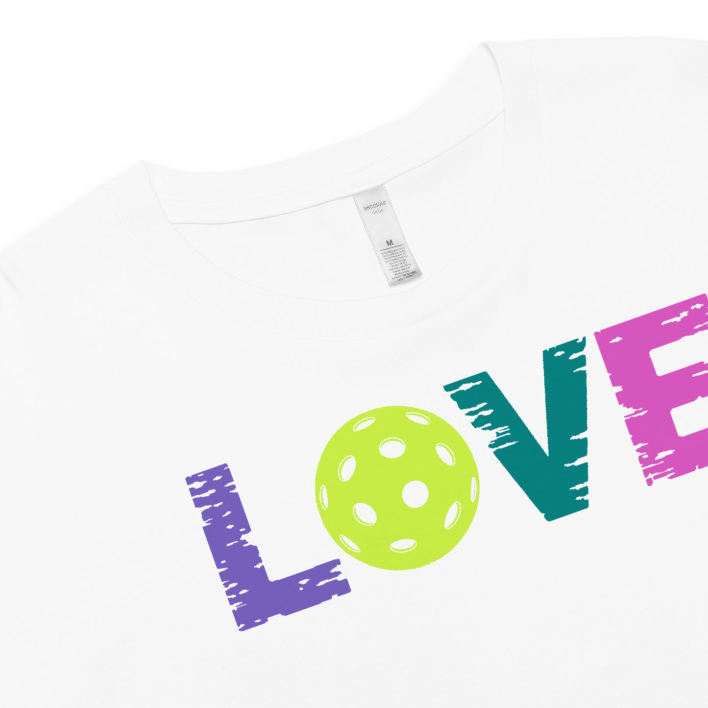 White crop top with colorful "LOVE" text and pickleball graphic, perfect for pickleball enthusiasts.