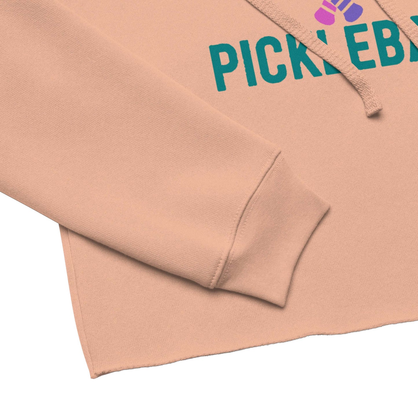 Detail of Women's Peace, Love, Pickleball Crop Hoodie showcasing sleeve and raw hem design.