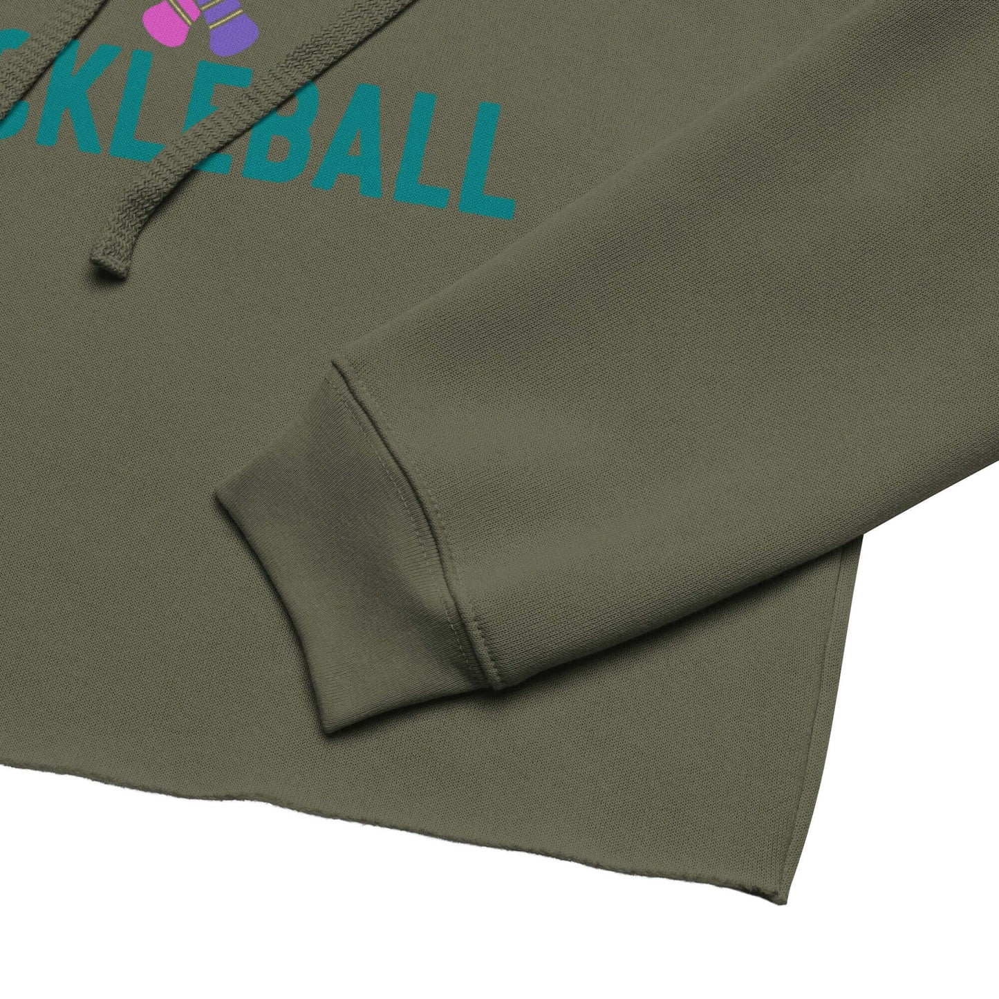 Close-up of a Women's Peace, Love, Pickleball Crop Hoodie showing sleeve detail with green fabric and colorful print.