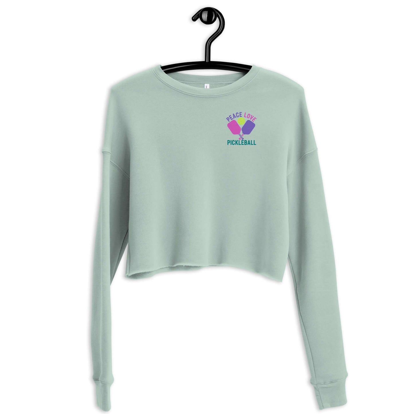 Women's crop sweatshirt in mint green with 'Peace Love Pickleball' graphic on front, perfect for stylish pickleball fans.