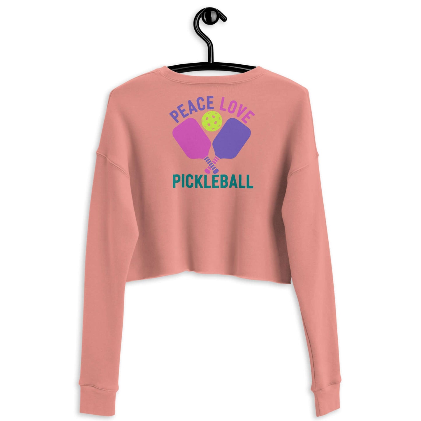 Back view of Women's Peace Love Pickleball Crop Sweatshirt in pink, featuring colorful graphic design.