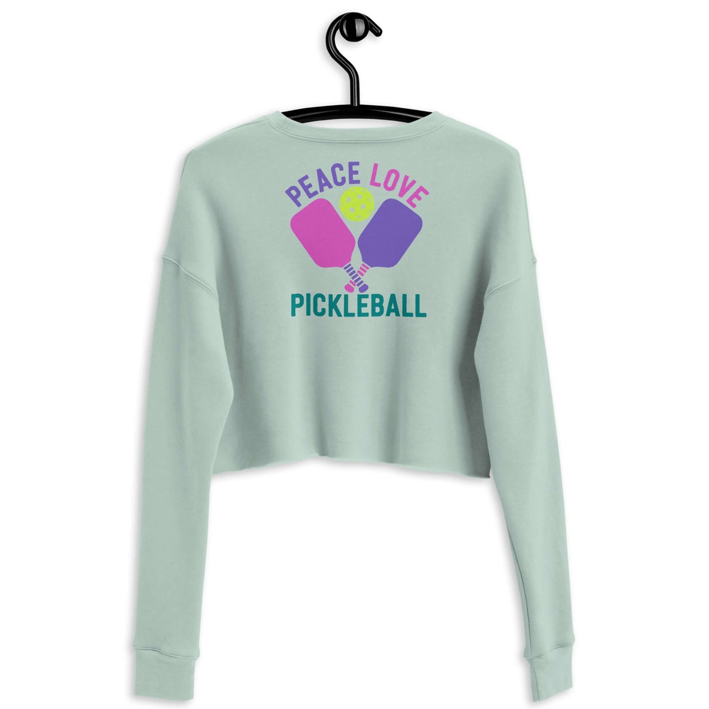 Mint green crop sweatshirt with 'Peace Love Pickleball' graphic and paddles design.