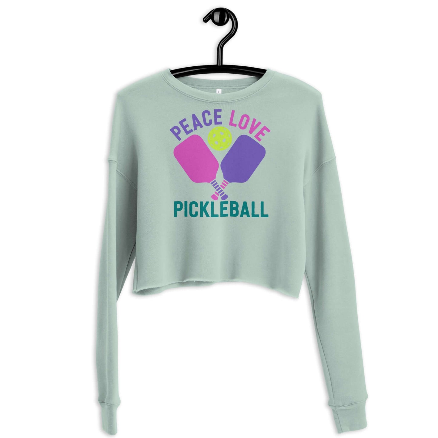 Women's Peace, Love, Pickleball crop sweatshirt in mint green with colorful pickleball graphic.