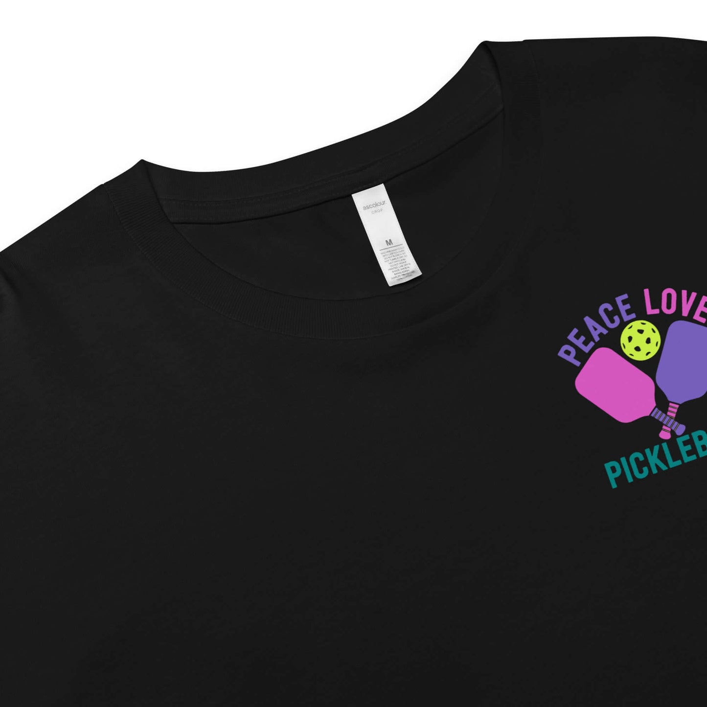 Women's Peace Love Pickleball Crop Top design featuring colorful paddles and ball on a black fabric.
