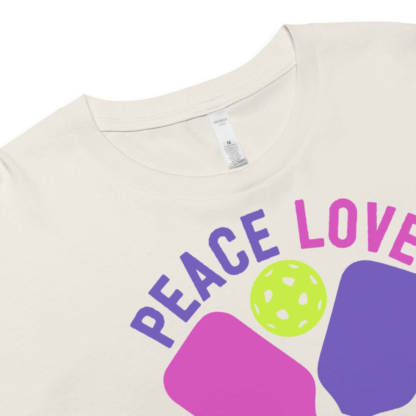 Close-up of Women's Peace, Love, Pickleball Crop Top with vibrant graphics and soft fabric.
