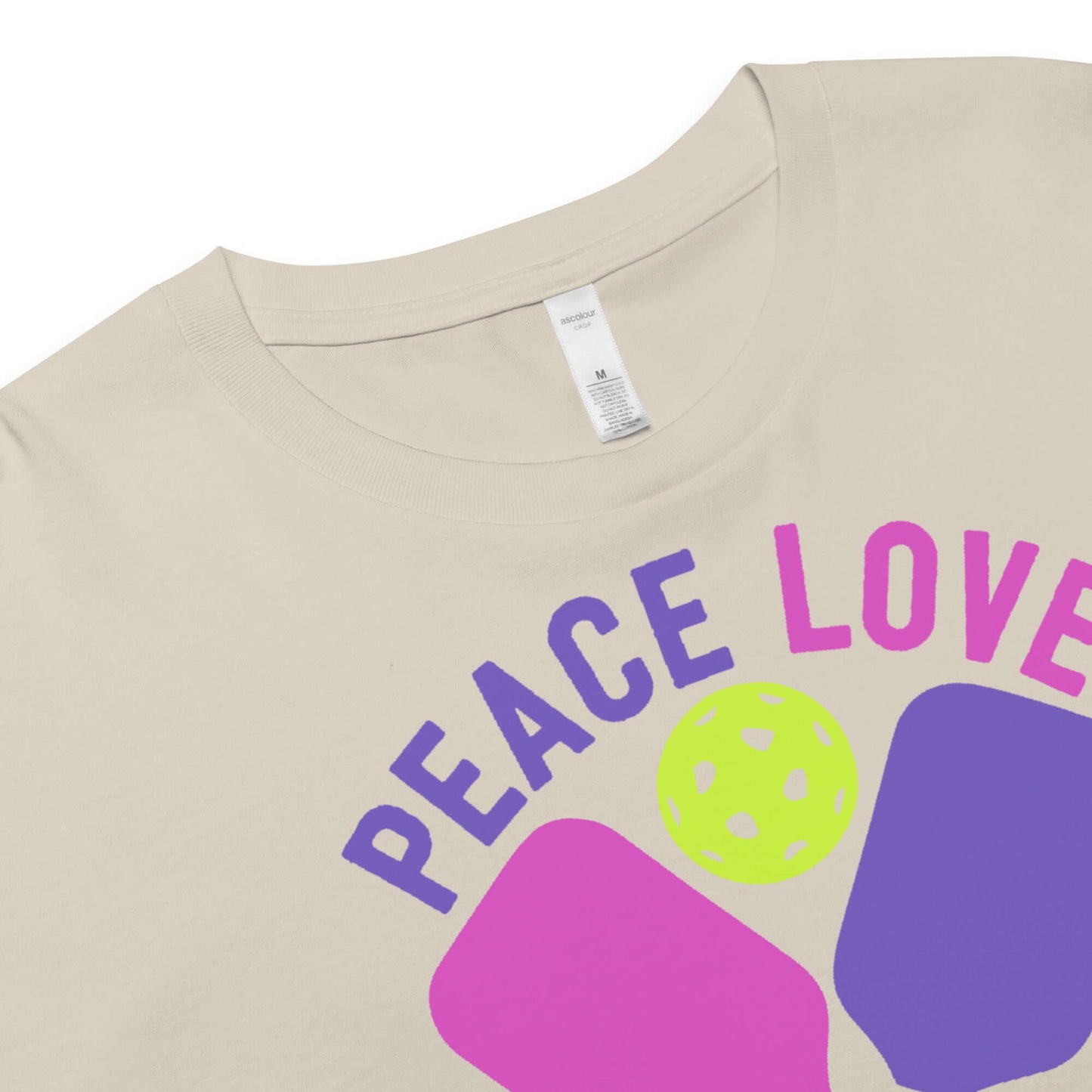 Close-up of Women's Peace, Love, Pickleball Crop Top showing vibrant design and comfortable neckline.