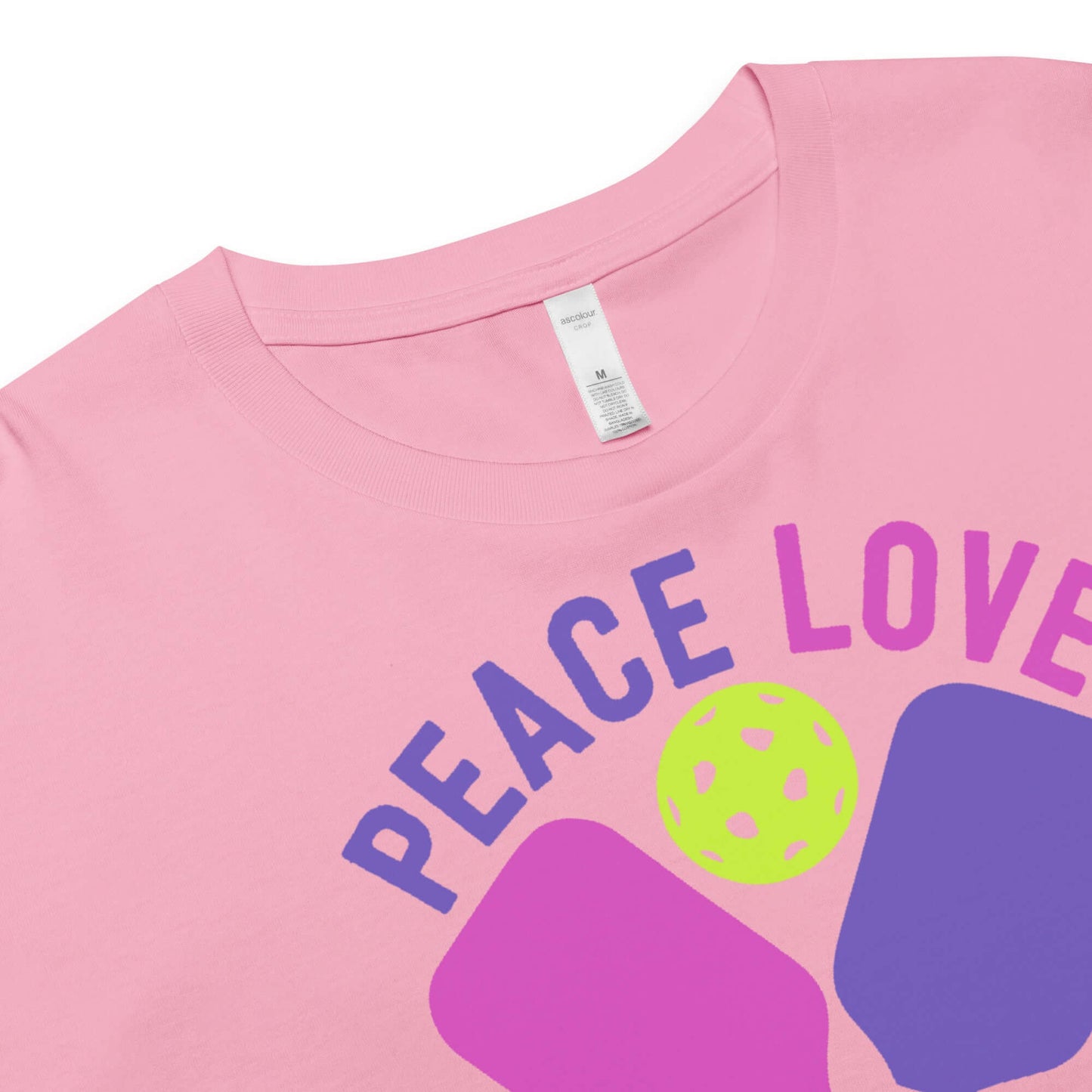 Close-up of Women's Peace, Love, Pickleball Crop Top showing vibrant design and soft material.
