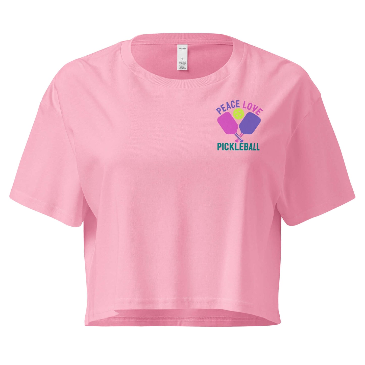 Women's pink crop top with 'Peace Love Pickleball' graphic design, ideal for pickleball enthusiasts.