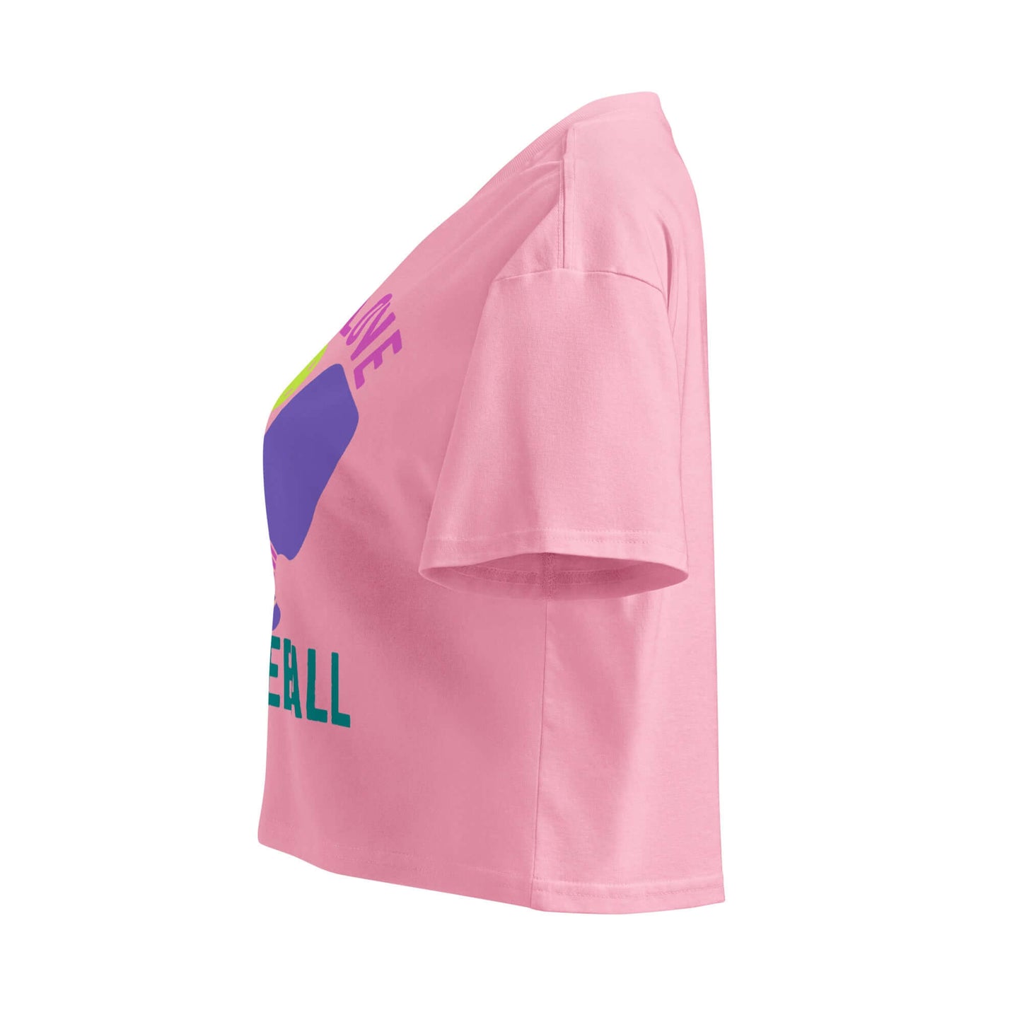 Side view of Women's Peace, Love, Pickleball crop top in pink, featuring vibrant graphic design for stylish pickleball enthusiasts.