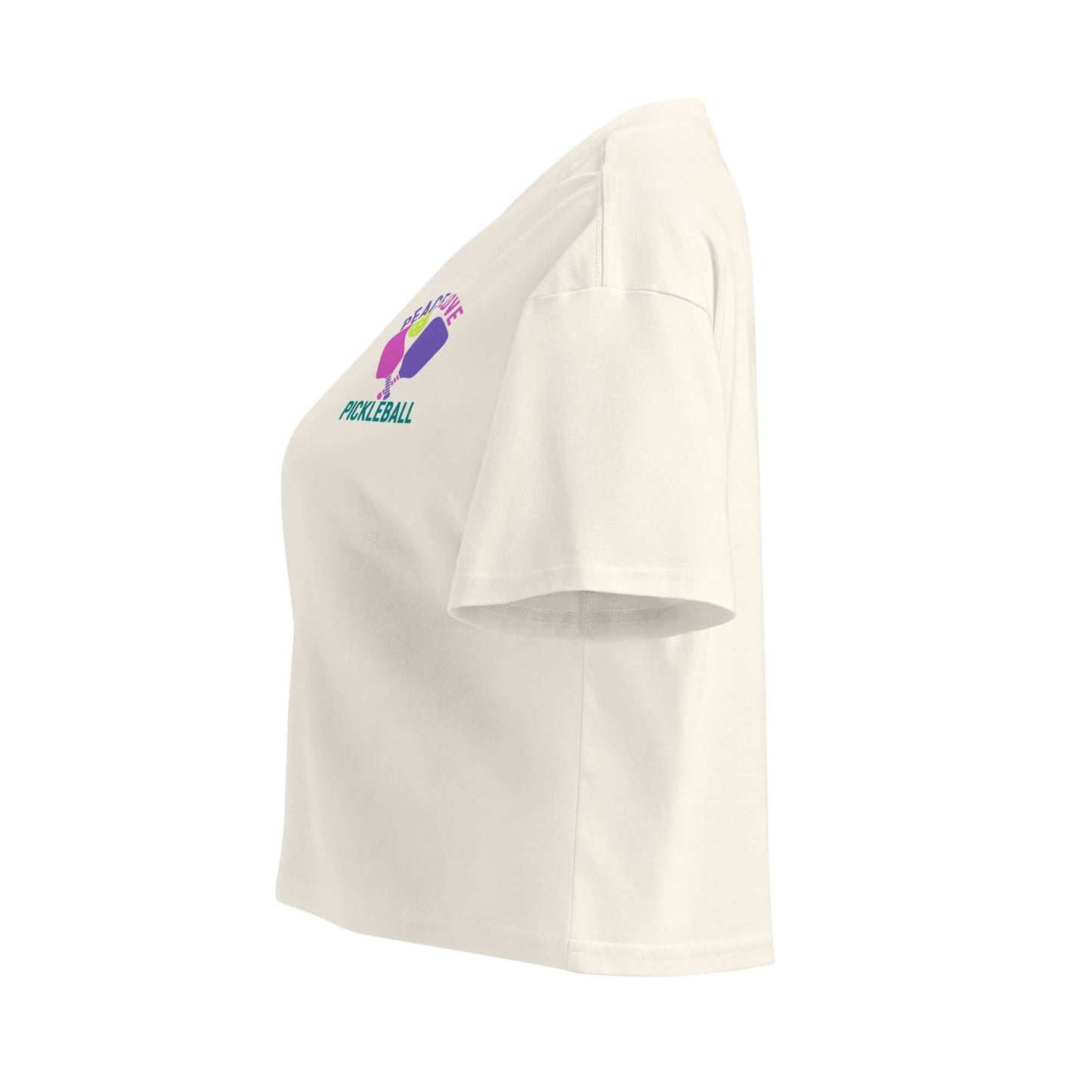 Side view of Women's Peace, Love, Pickleball Crop Top in cream, showcasing sporty design and vibrant pickleball graphic.
